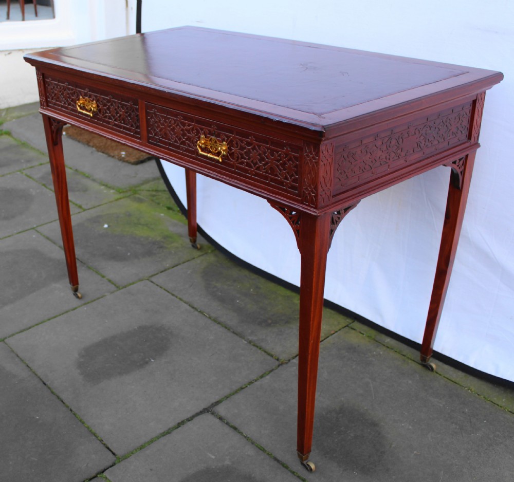Victorian mahogany side/writing table with blind fret carving View VI