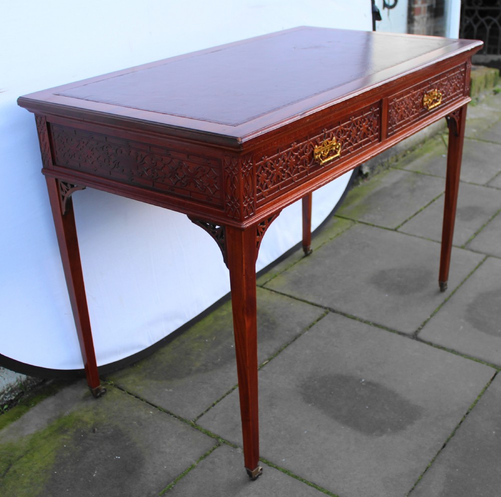 Victorian mahogany side/writing table with blind fret carving View VII