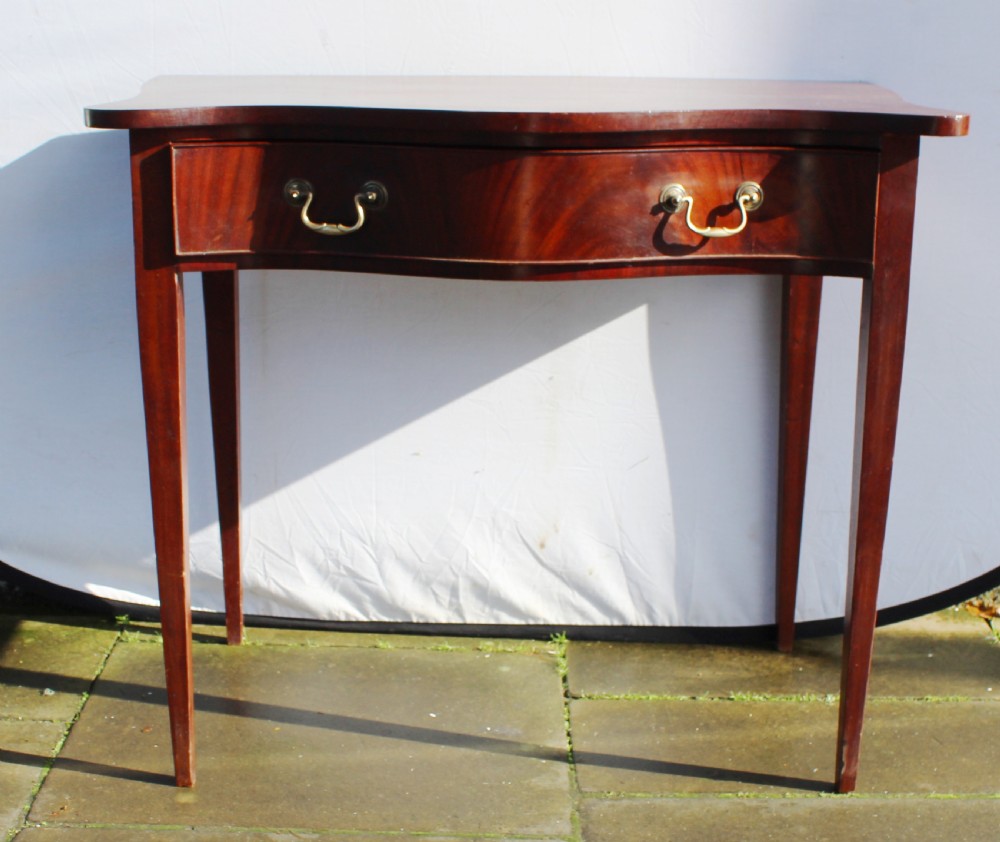 19th century figured mahogany serpentine side table View IV