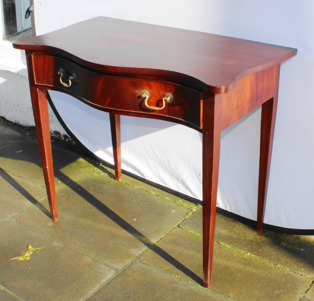 19th century figured mahogany serpentine side table View V