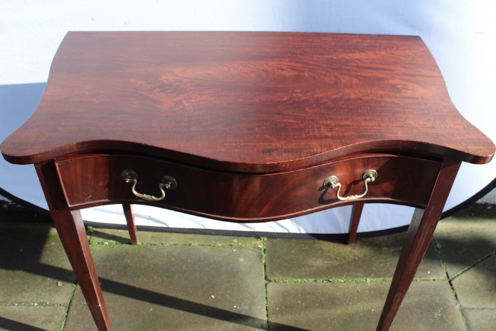 19th century figured mahogany serpentine side table View VII
