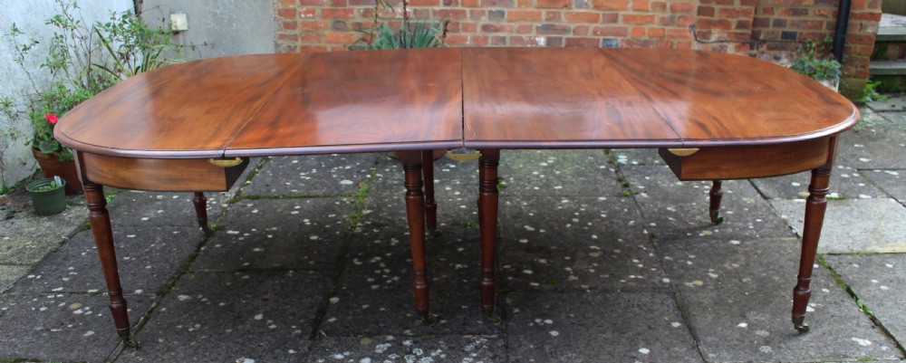 Large early 19th century mahogany dining table View III