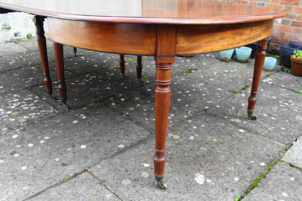 Large early 19th century mahogany dining table View V