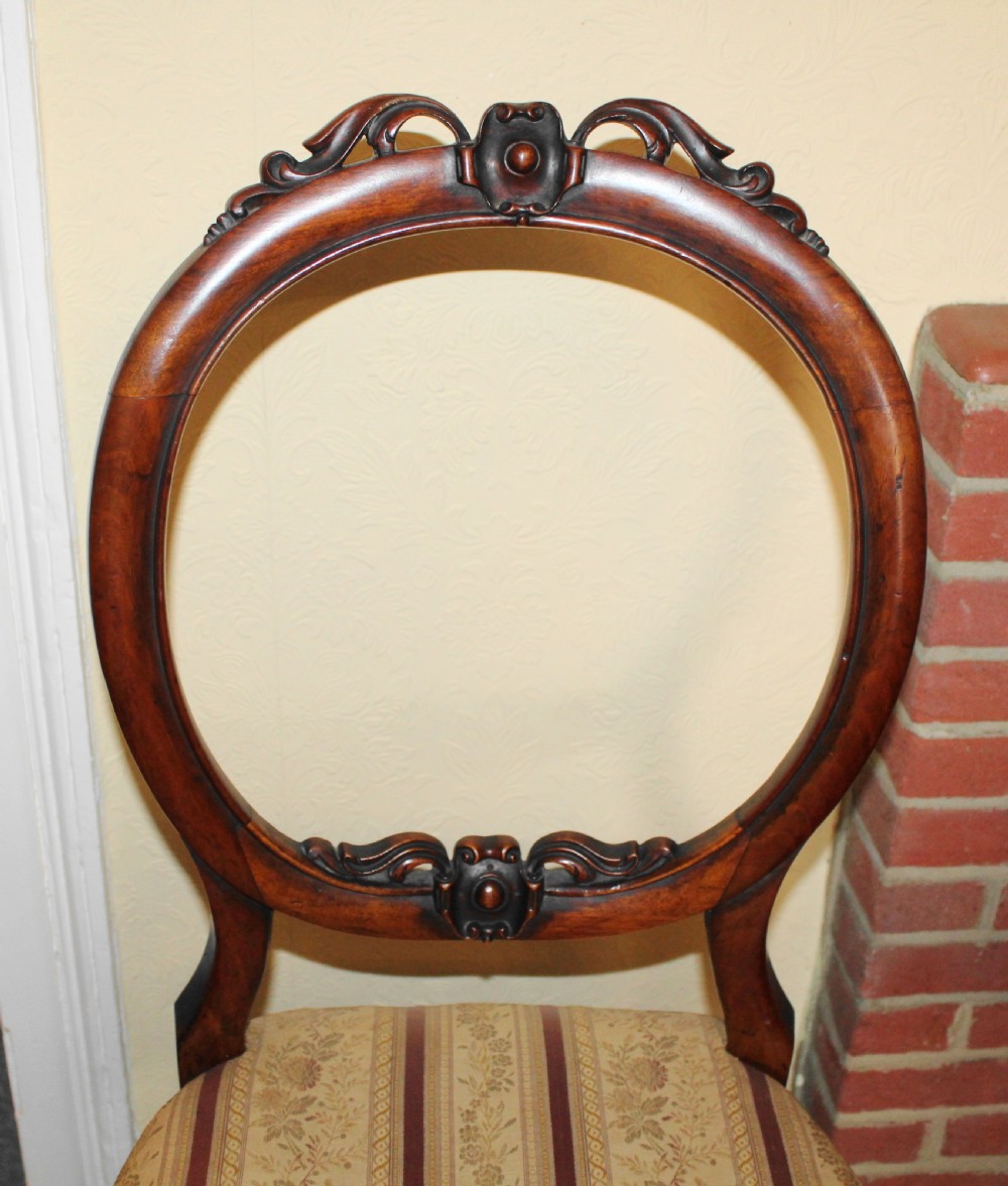 Set of six Victorian walnut balloon back dining chairs View IV