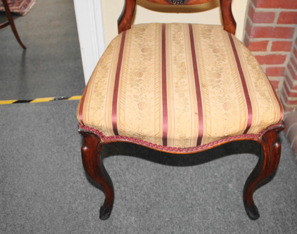 Set of six Victorian walnut balloon back dining chairs View V