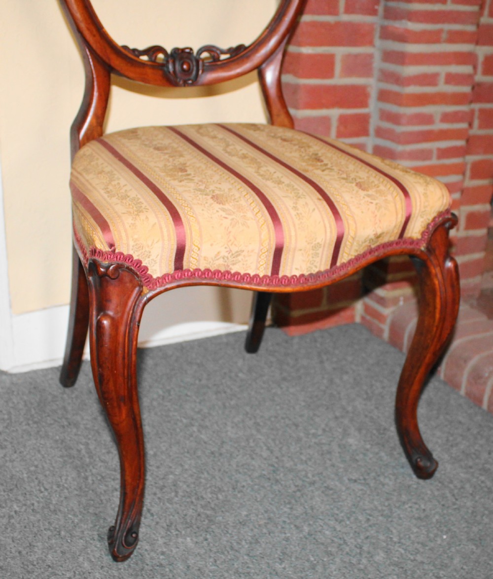 Set of six Victorian walnut balloon back dining chairs View VI