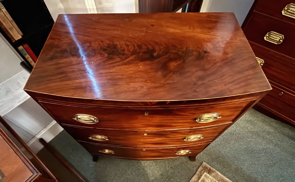 Small Regency figured mahogany bow front chest of drawers View III