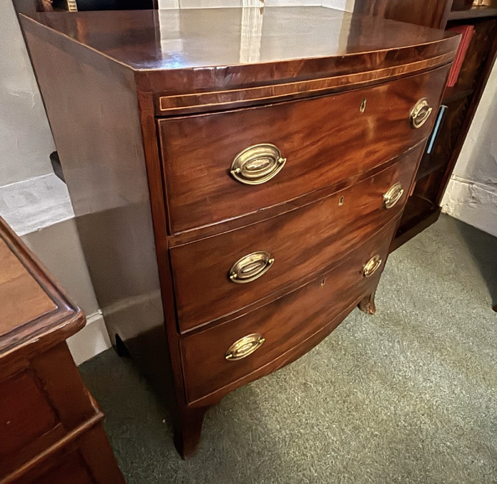 Small Regency figured mahogany bow front chest of drawers View VII