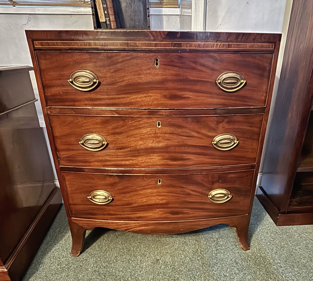 Small Regency figured mahogany bow front chest of drawers View VIII