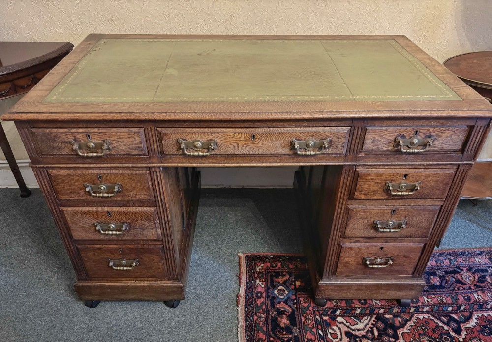 Edwardian oak pedestal desk with gilt tooled leather top View III