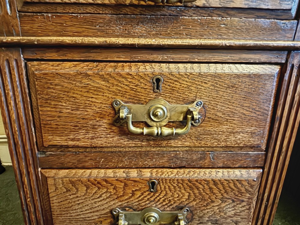 Edwardian oak pedestal desk with gilt tooled leather top View V