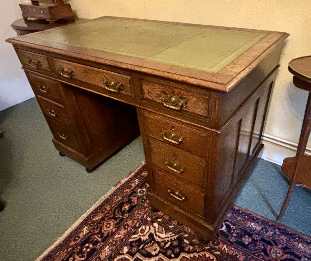 Edwardian oak pedestal desk with gilt tooled leather top View VI