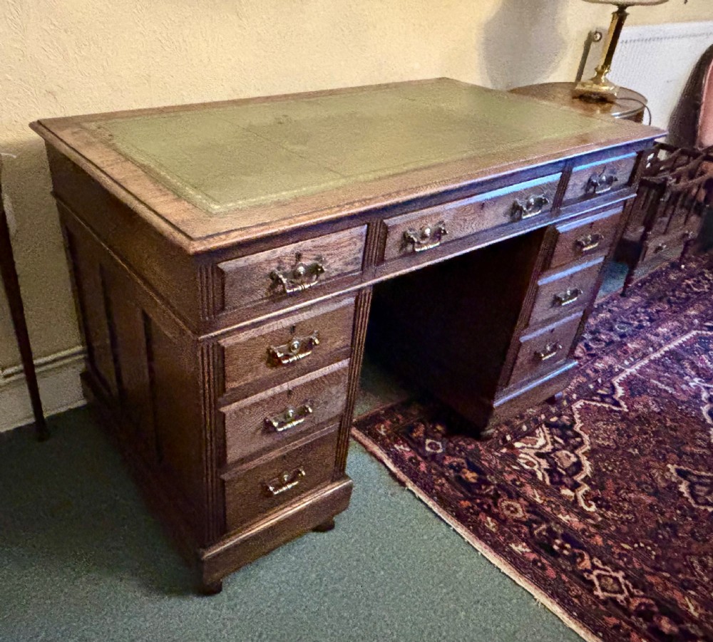 Edwardian oak pedestal desk with gilt tooled leather top View VII