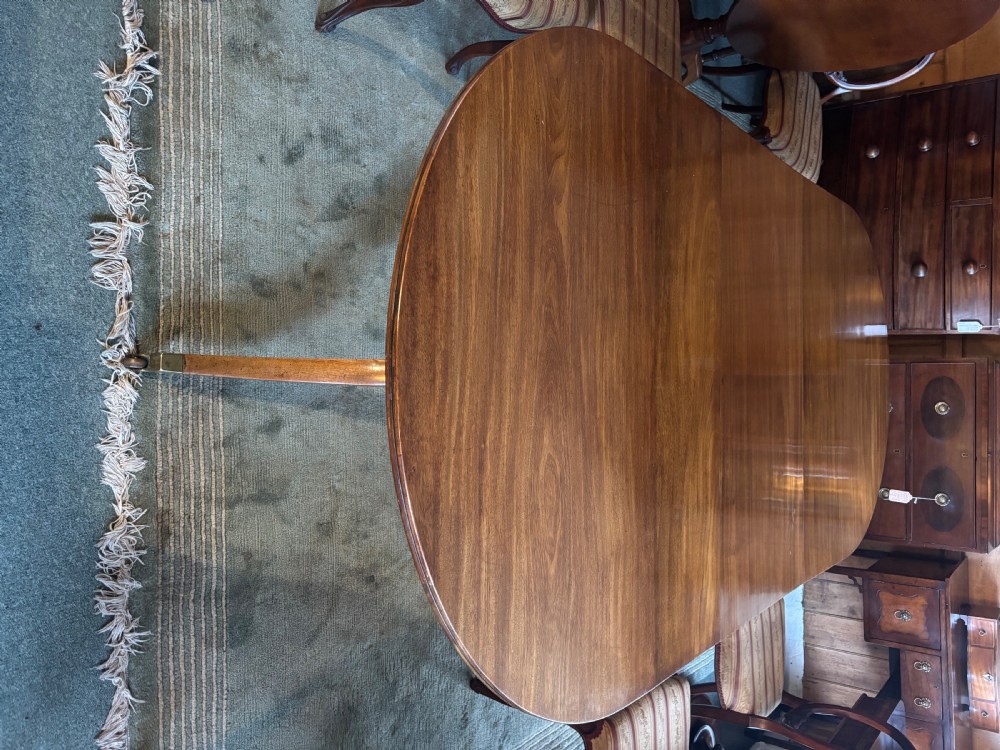 Fine quality 19th century figured mahogany Regency design twin pillar dining table View VIII