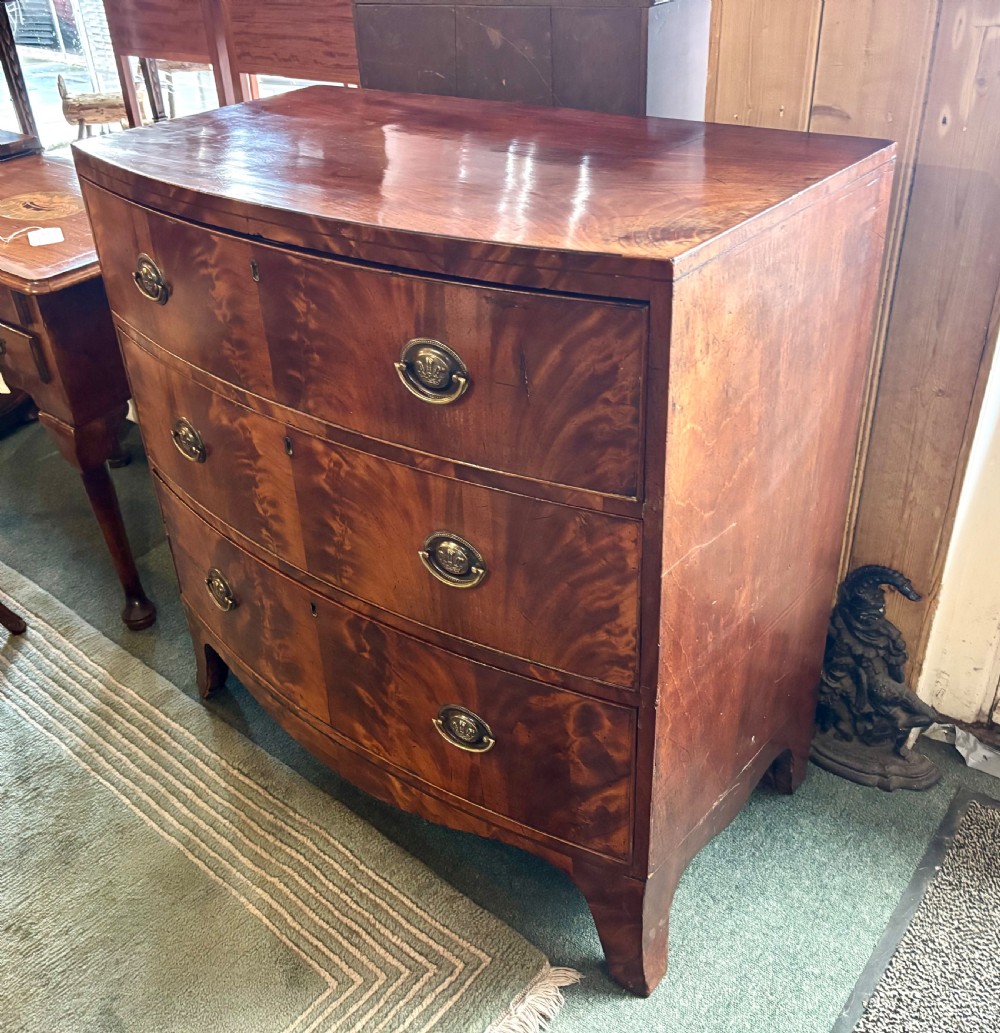 Regency figured mahogany small bow front chest of drawers  View V