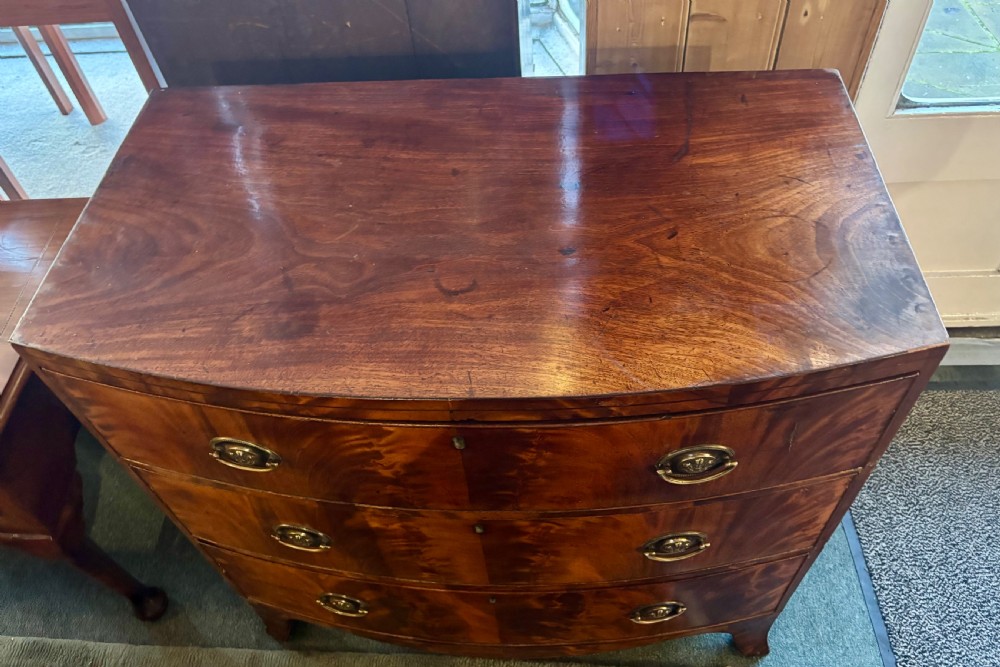 Regency figured mahogany small bow front chest of drawers  View VI