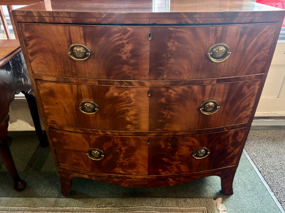 Regency figured mahogany small bow front chest of drawers  View VIII