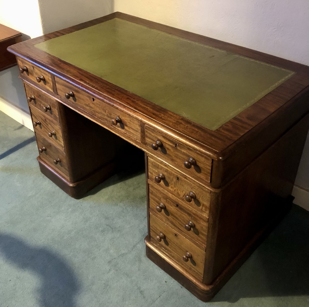 Victorian mahogany pedestal desk with green leather top View II