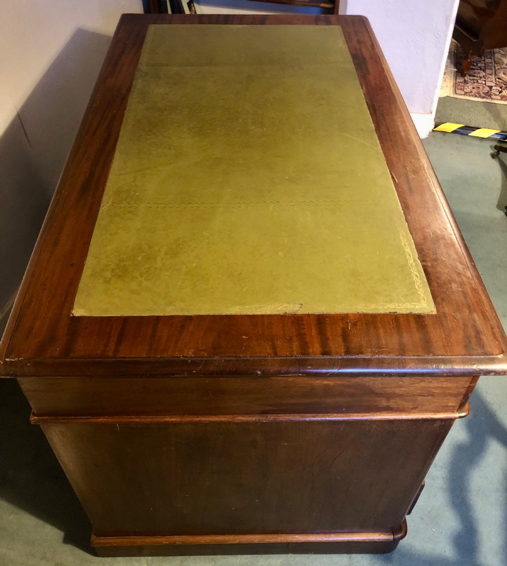 Victorian mahogany pedestal desk with green leather top View III