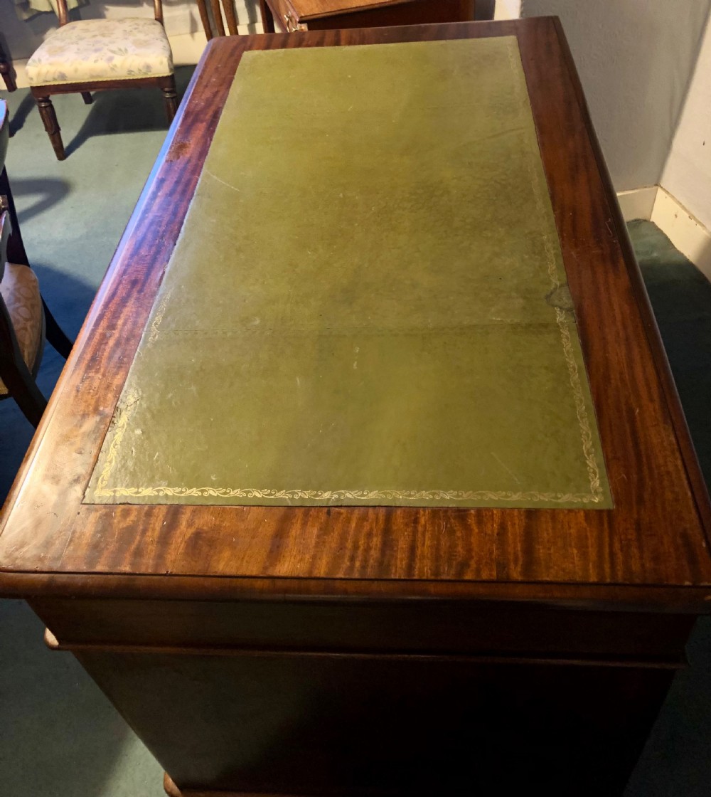 Victorian mahogany pedestal desk with green leather top View IV