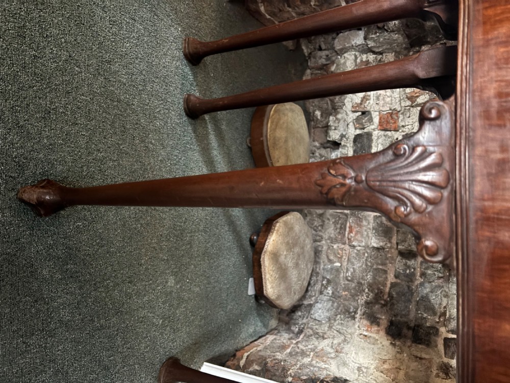 A George III mahogany demi-lune card table with carved shell knees and cabriole legs. View XI