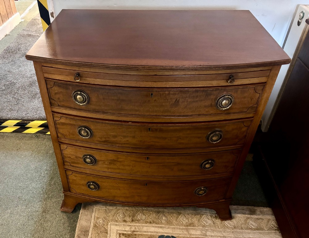 Small Edwardian mahogany and ebony inlaid bow front chest of drawers with brushing slide View VI