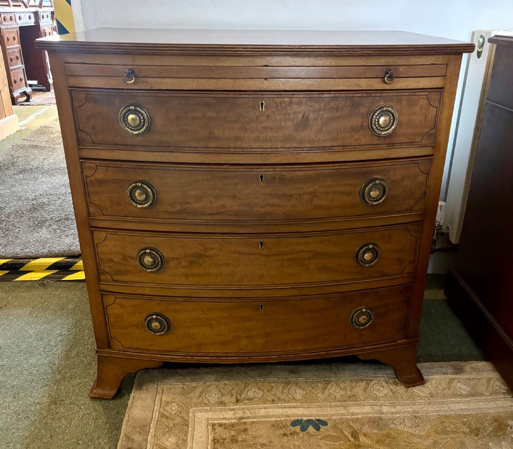 Small Edwardian mahogany and ebony inlaid bow front chest of drawers with brushing slide View VII