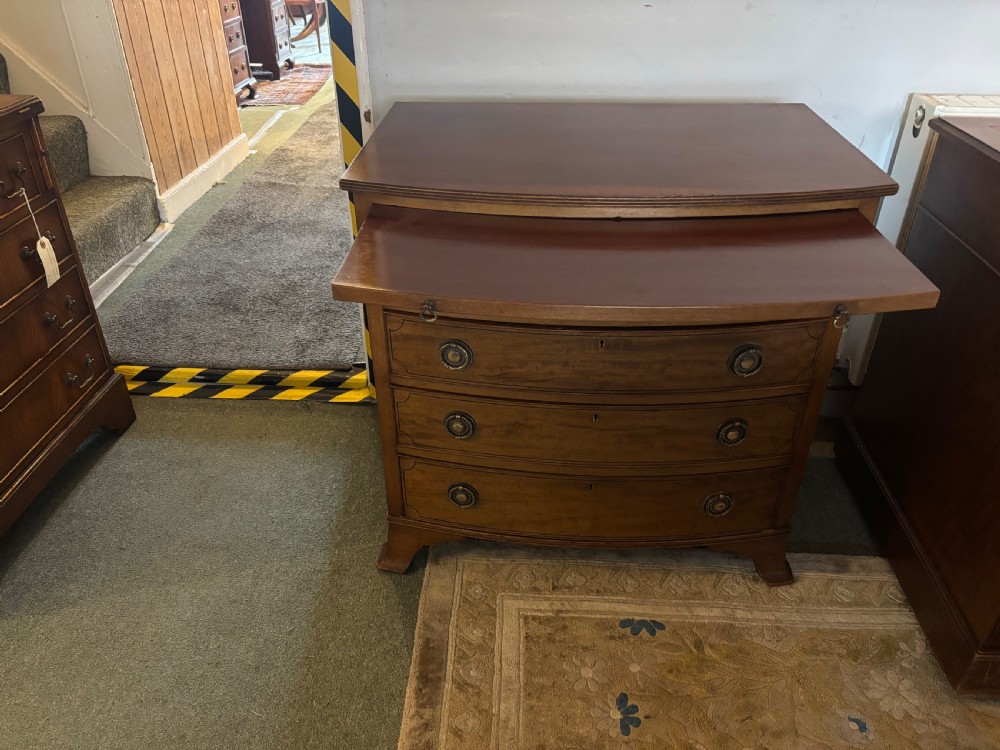 Small Edwardian mahogany and ebony inlaid bow front chest of drawers with brushing slide View VIII