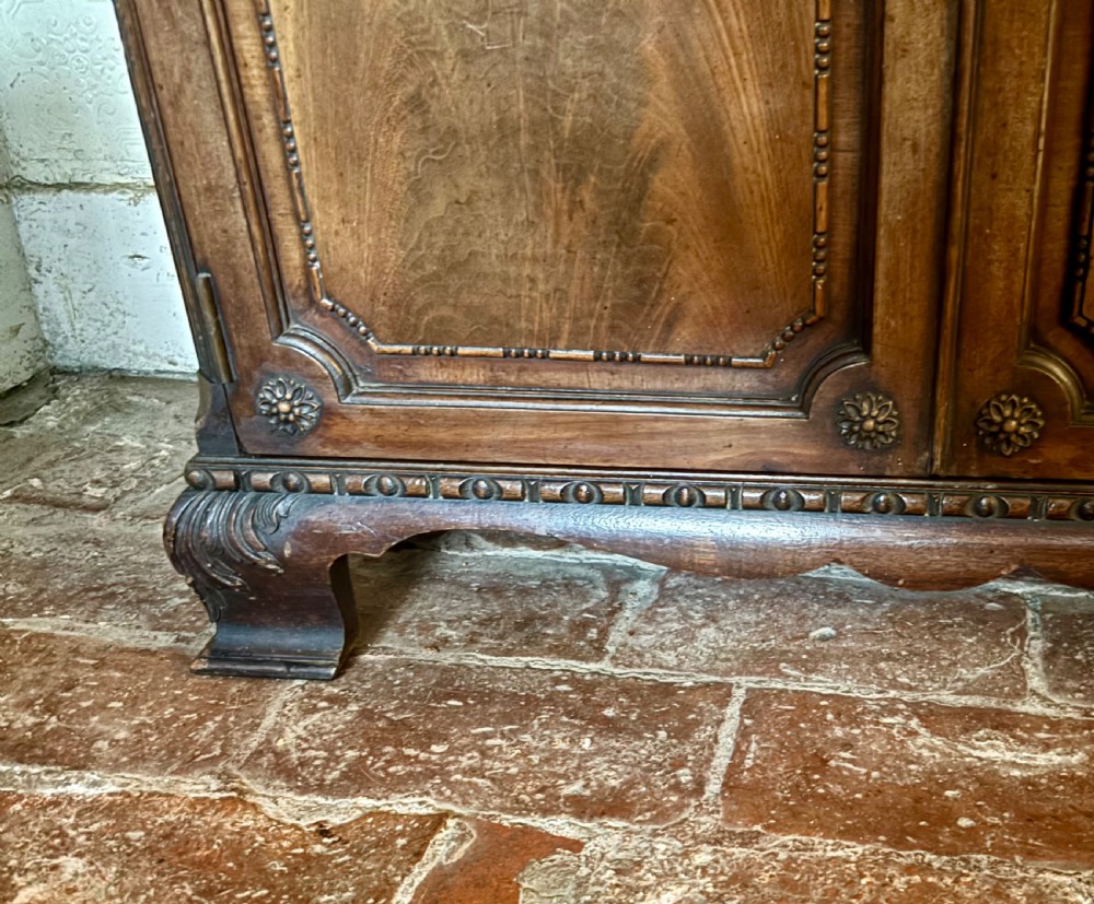 An early twentieth-century glazed mahogany display cabinet featuring an upper single glazed door section above a single drawer and double cupboard base. View XIV
