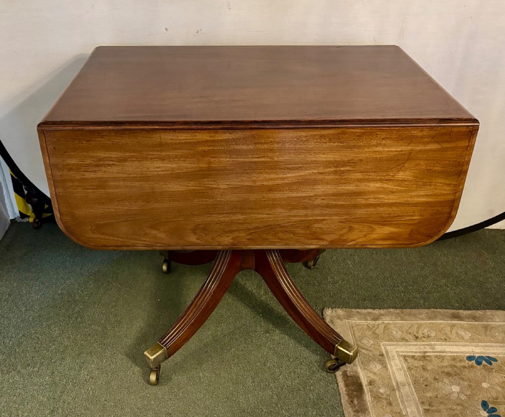 Small Regency figured mahogany supper table