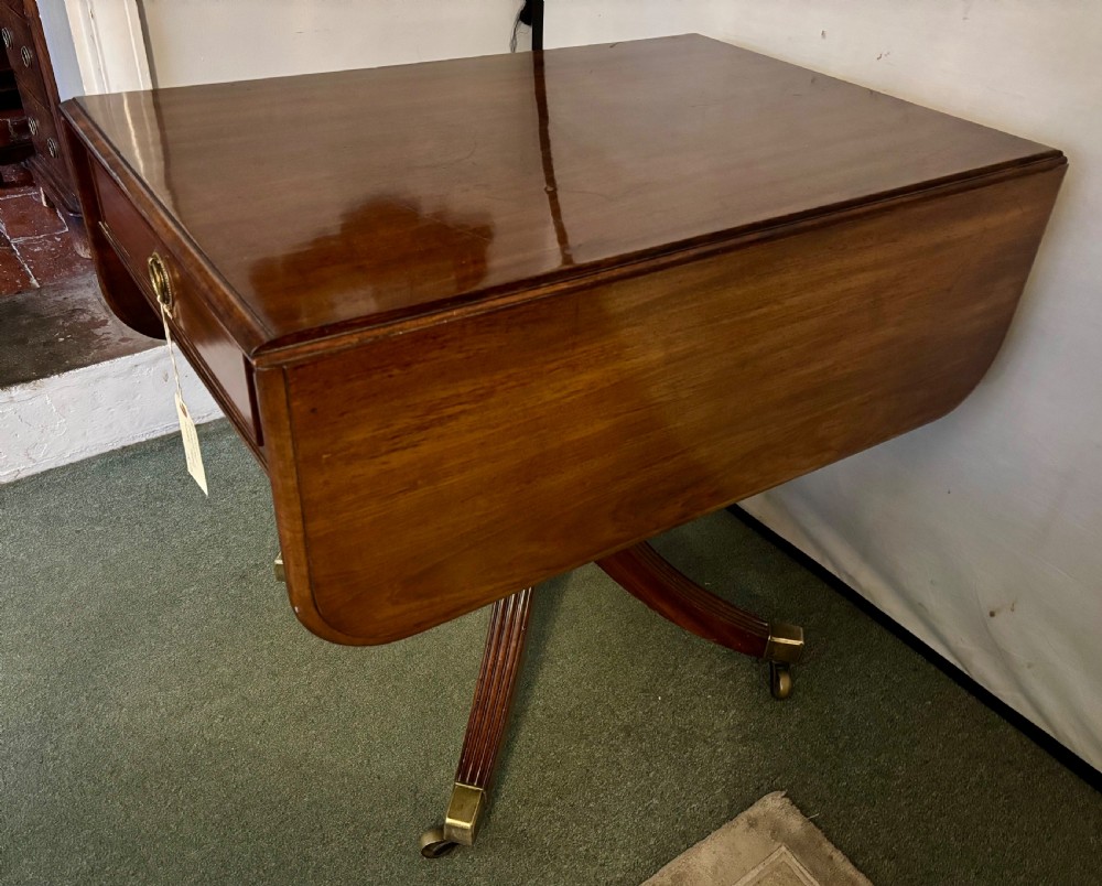 Small Regency figured mahogany supper table View III