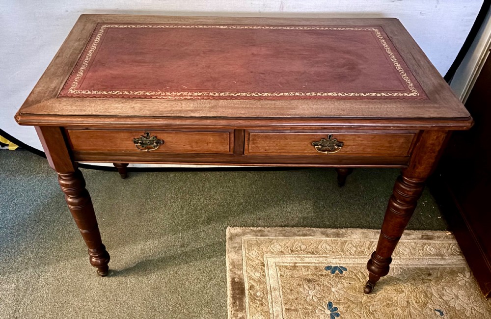 VictorIan mahogany writing table with burgundy leather top