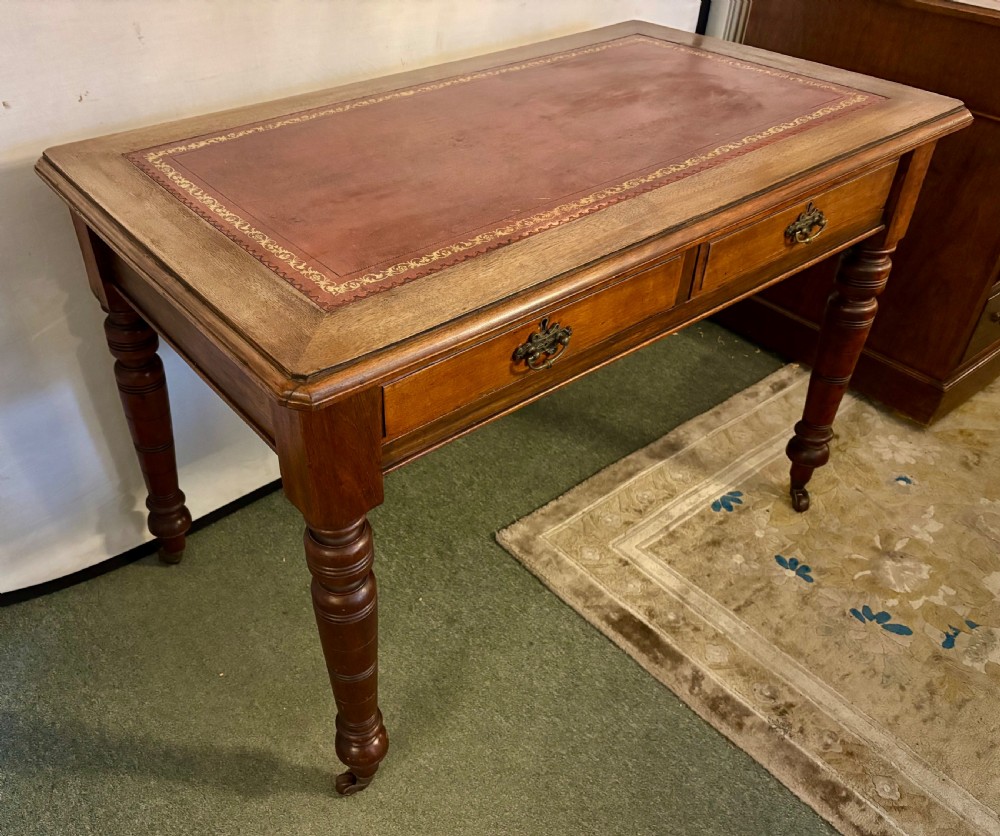 VictorIan mahogany writing table with burgundy leather top View II