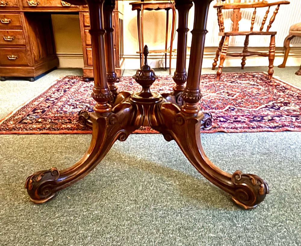 Fine Victorian figured walnut and inlaid oval breakfast table View II