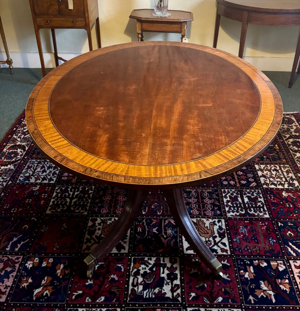Regency mahogany and crossbanded oval breakfast table View II