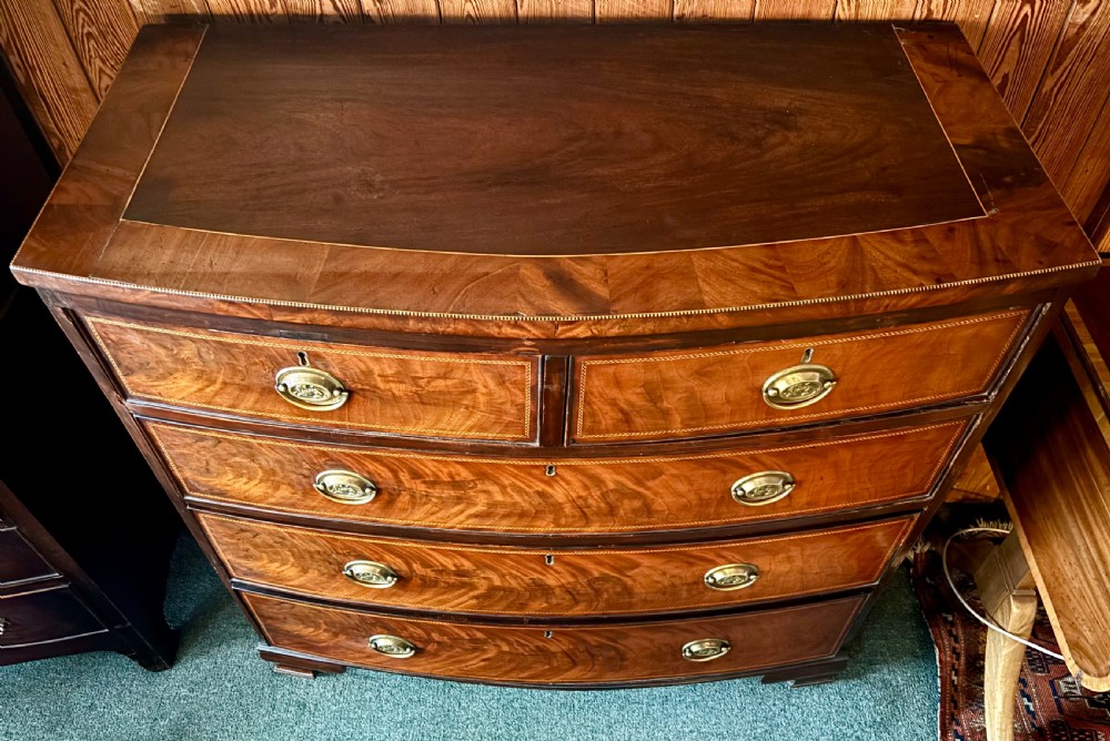 Early 19th century mahogany and cross-banded bow-front chest of drawers View III