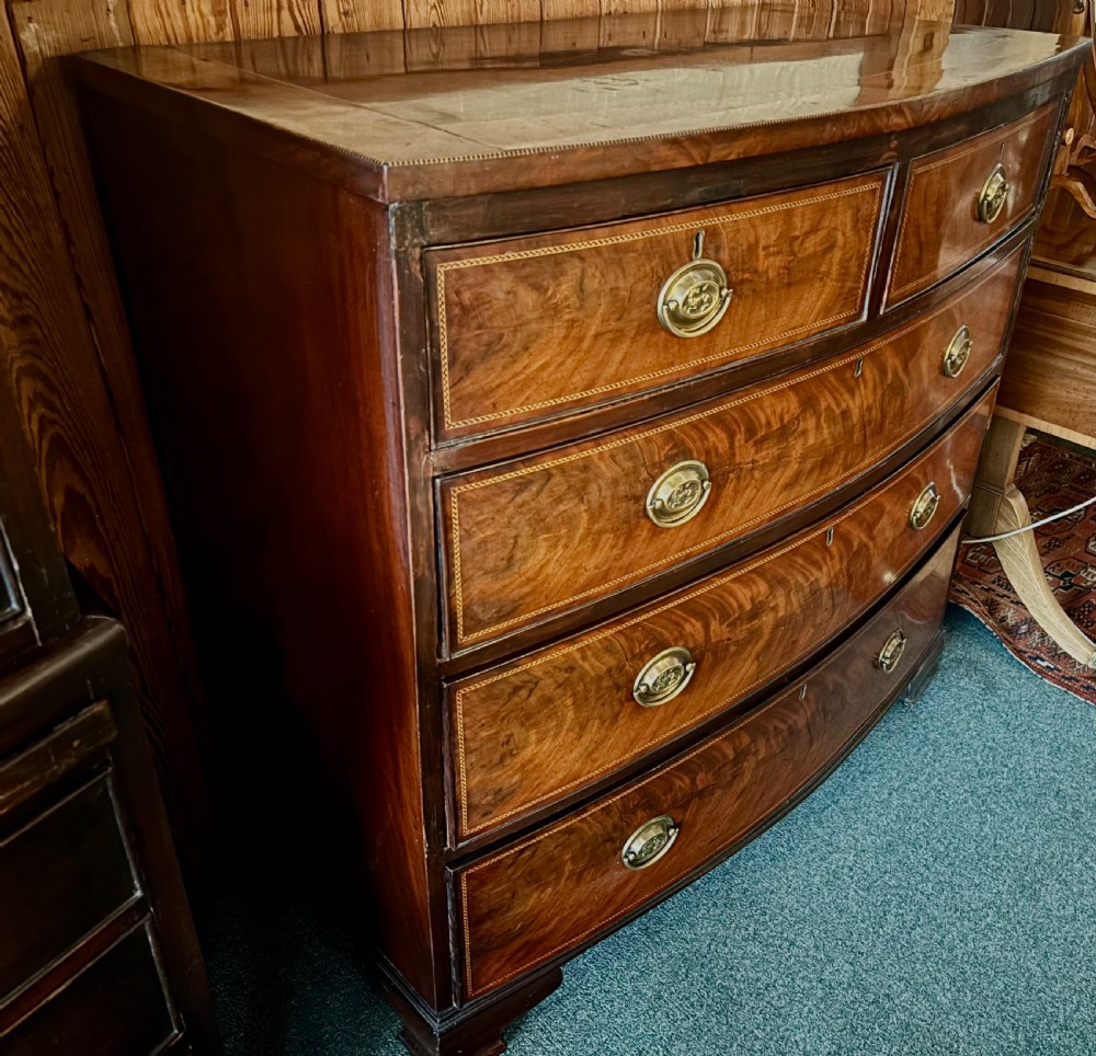 Early 19th century mahogany and cross-banded bow-front chest of drawers View IV