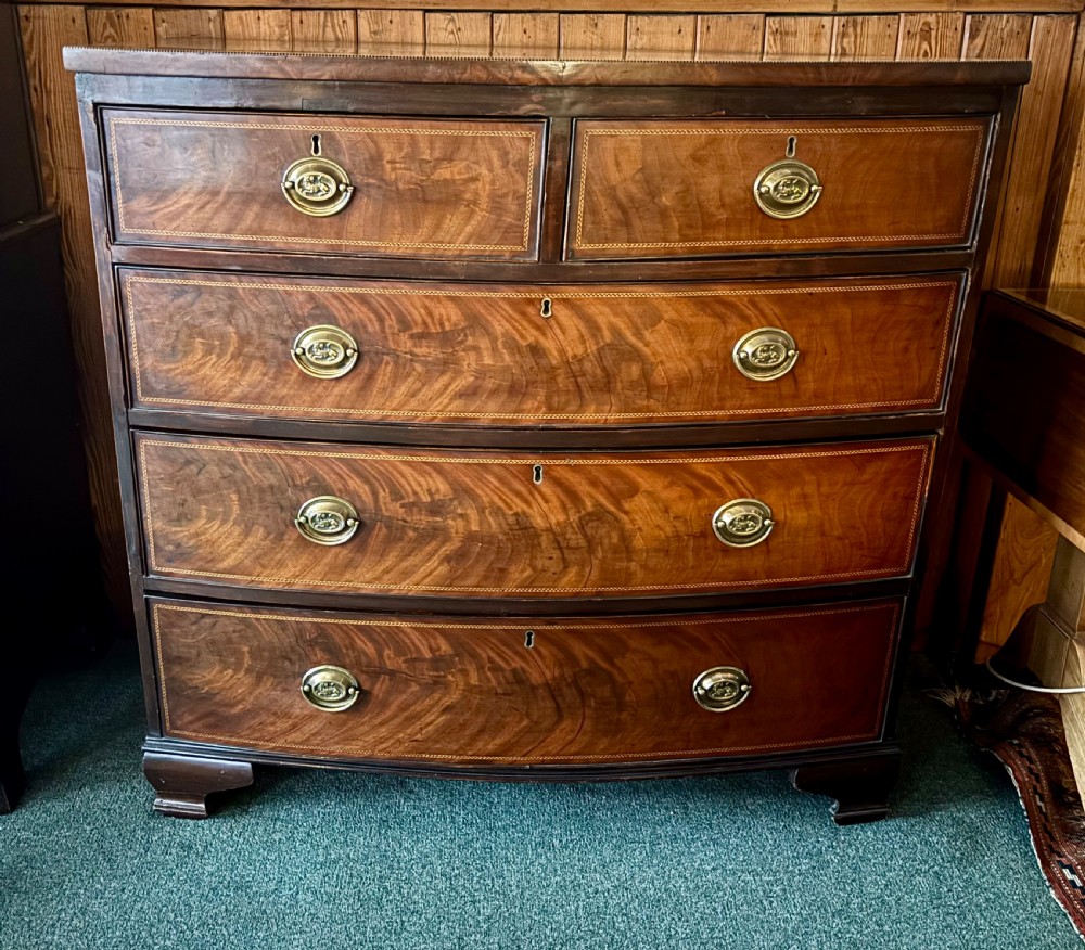 Early 19th century mahogany and cross-banded bow-front chest of drawers View VI
