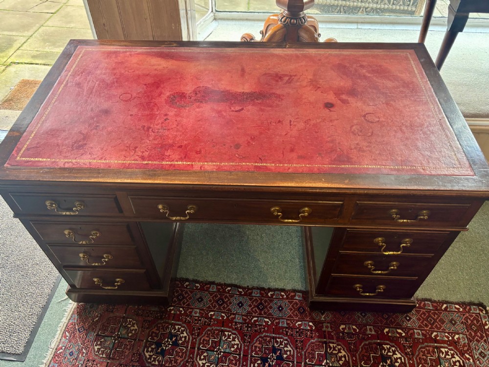 Large Edwardian mahogany pedestal desk with burgundy leather top View III