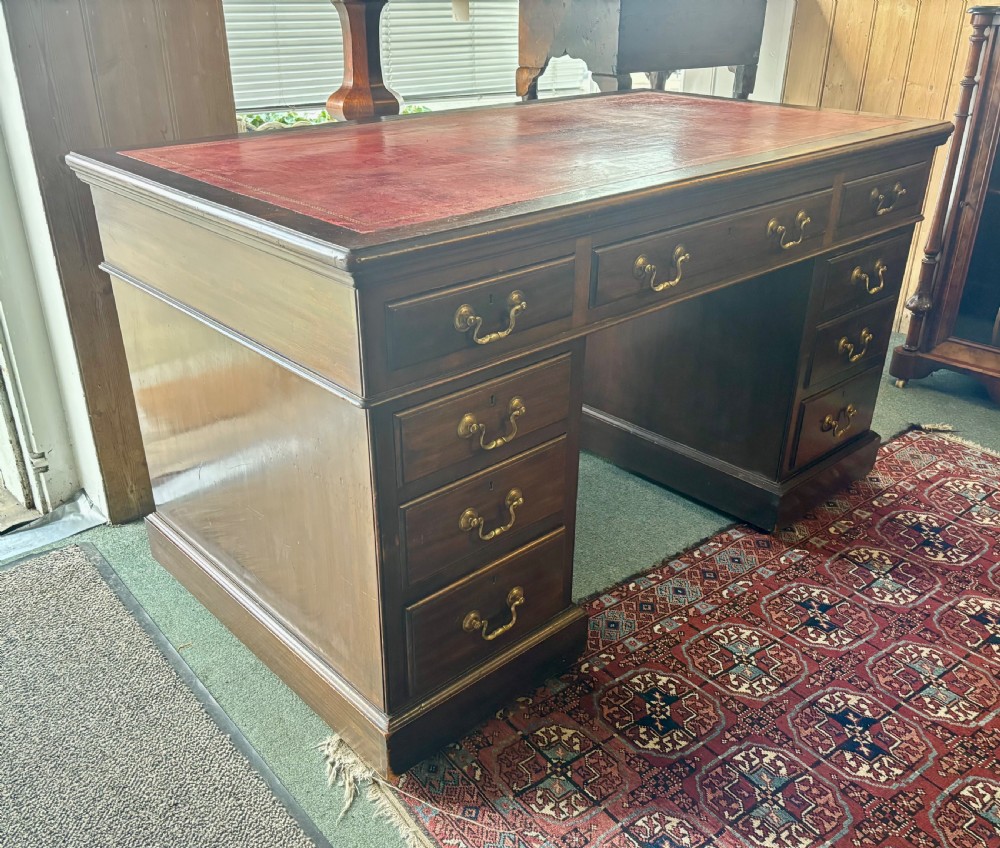 Large Edwardian mahogany pedestal desk with burgundy leather top View VI