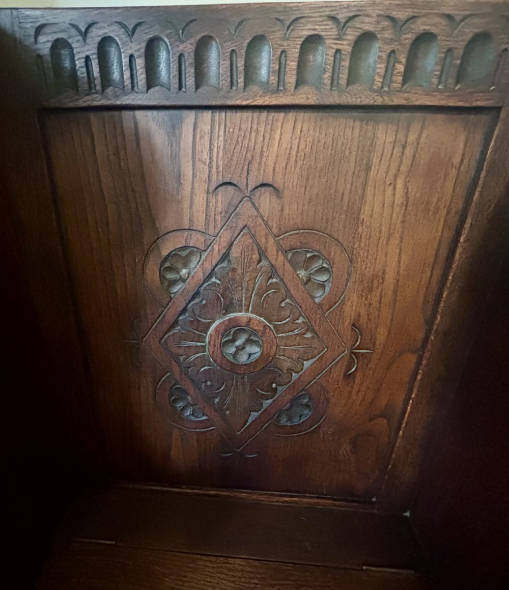 A George III walnut small chest of drawers with decorative brass handles, fluted canted corners, and bracket feet. View VII