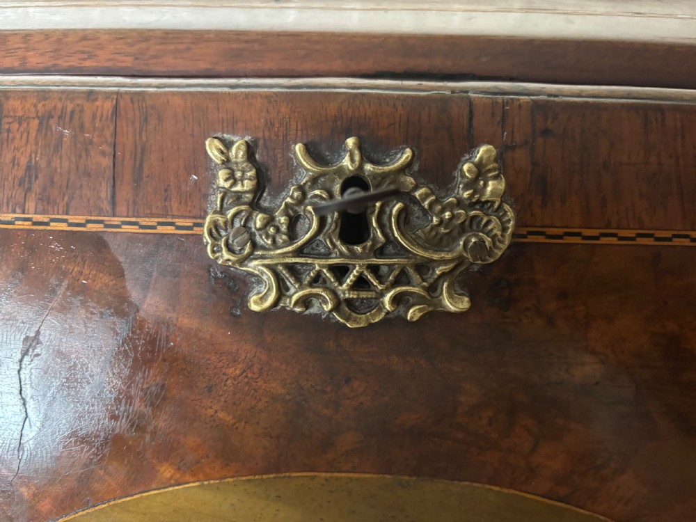 An 18th-century George III mahogany slant-front bureau featuring satinwood shell inlays and four graduating drawers with brass handles. View XI
