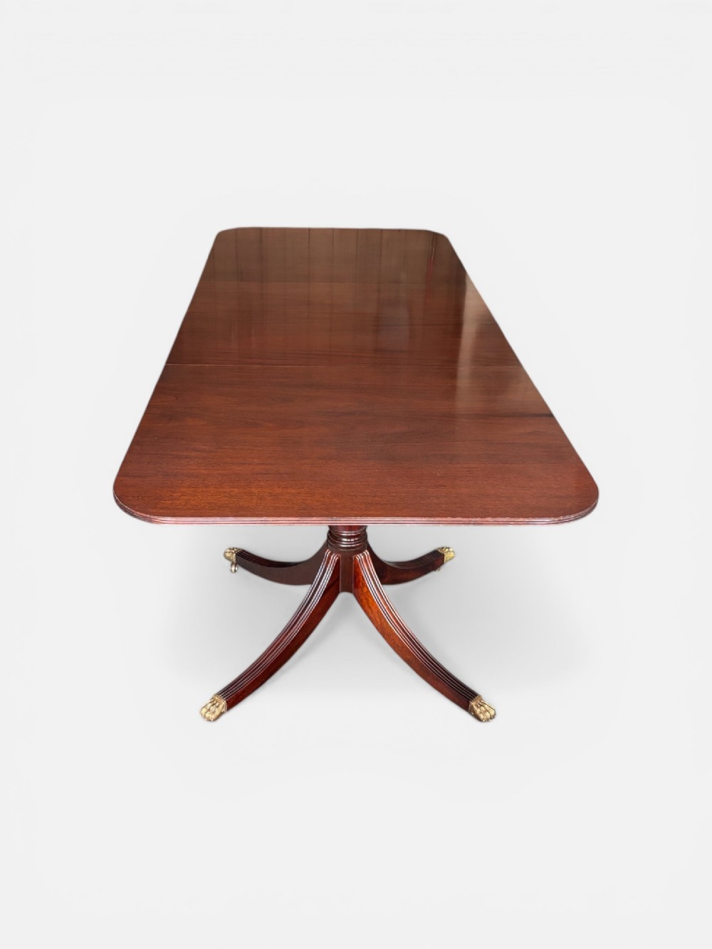 Fine quality large Regency design mahogany twin pillar dining table