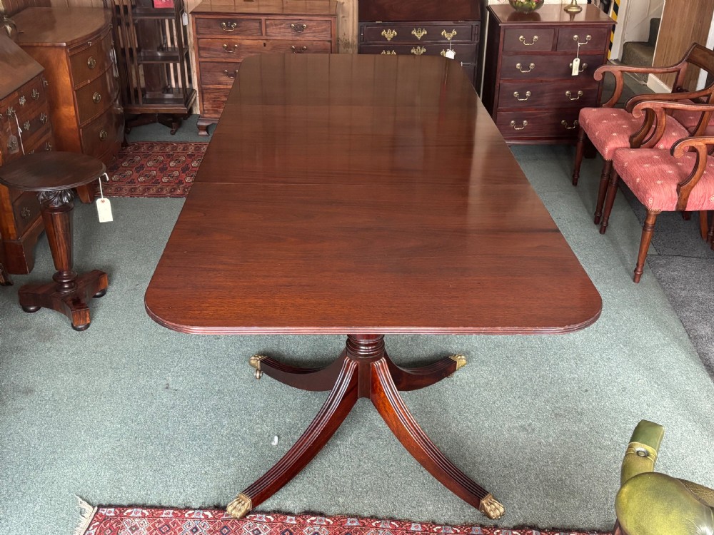 Fine quality large Regency design mahogany twin pillar dining table View V