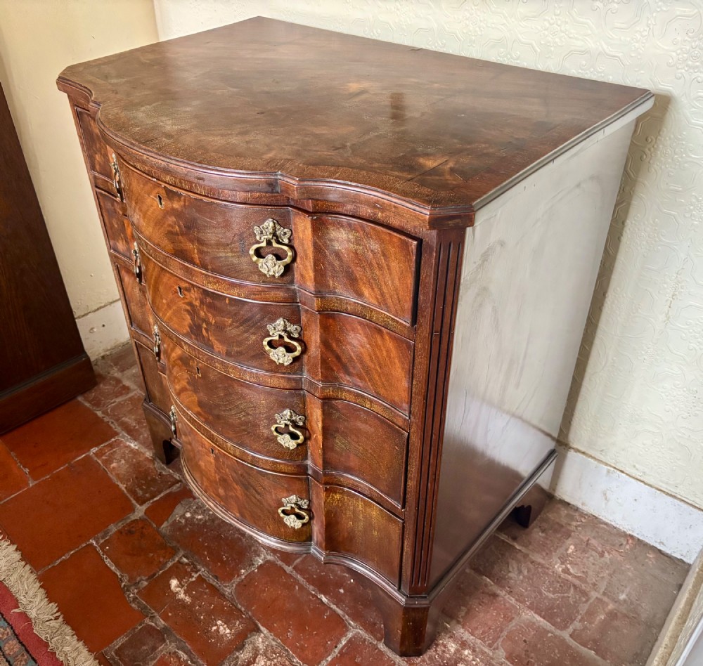 Edwardian small serpentine chest of drawers in well figured mahogany View VIII