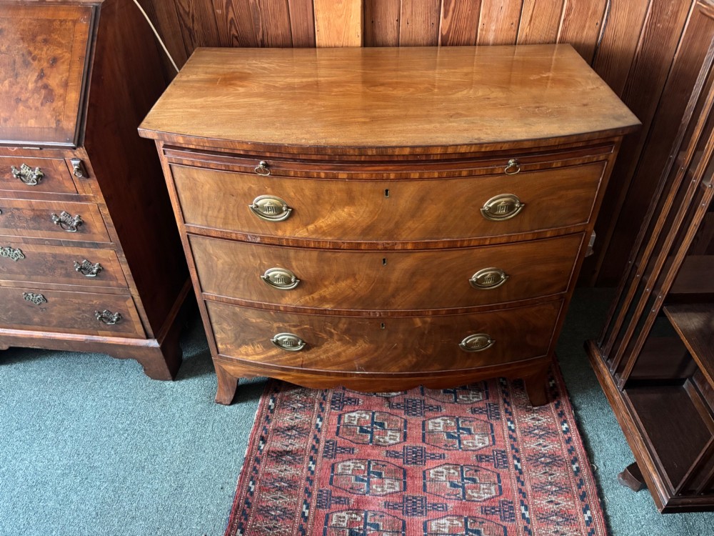 Fine Regency figured mahogany bow front chest of drawers View IX