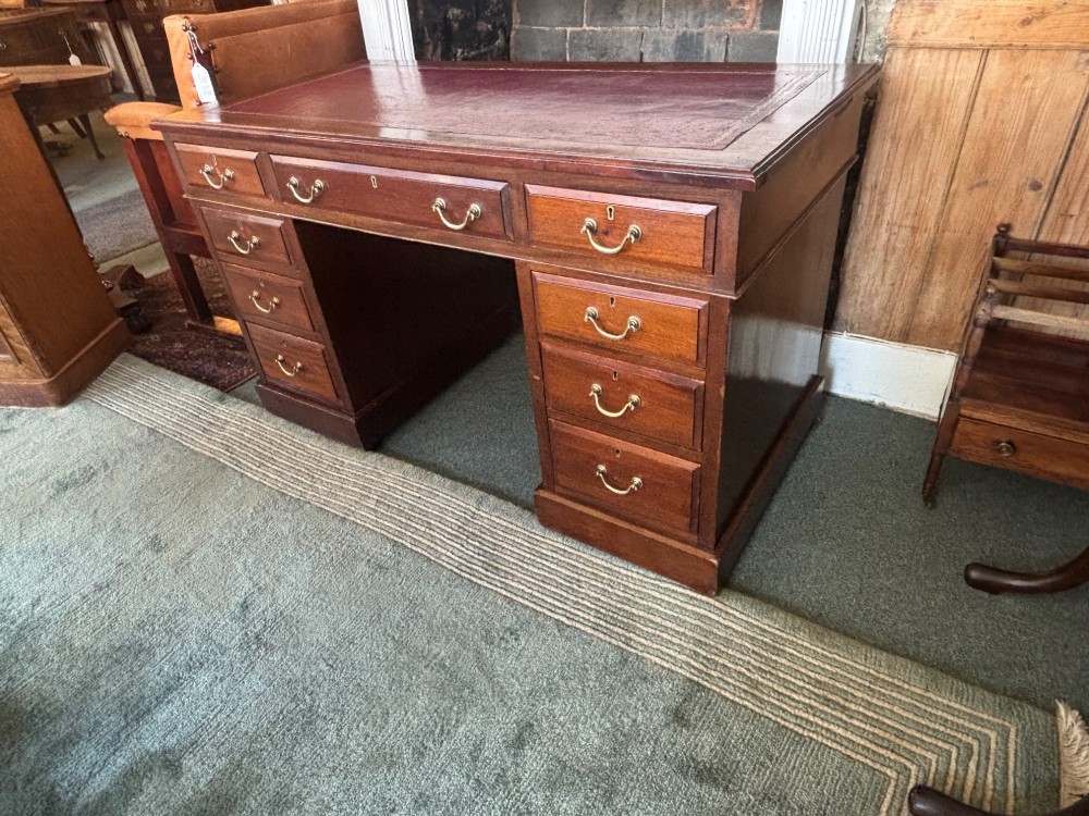 Victorian mahogany pedestal desk with burgundy leather top View V