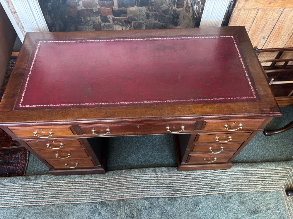 Victorian mahogany pedestal desk with burgundy leather top View VII