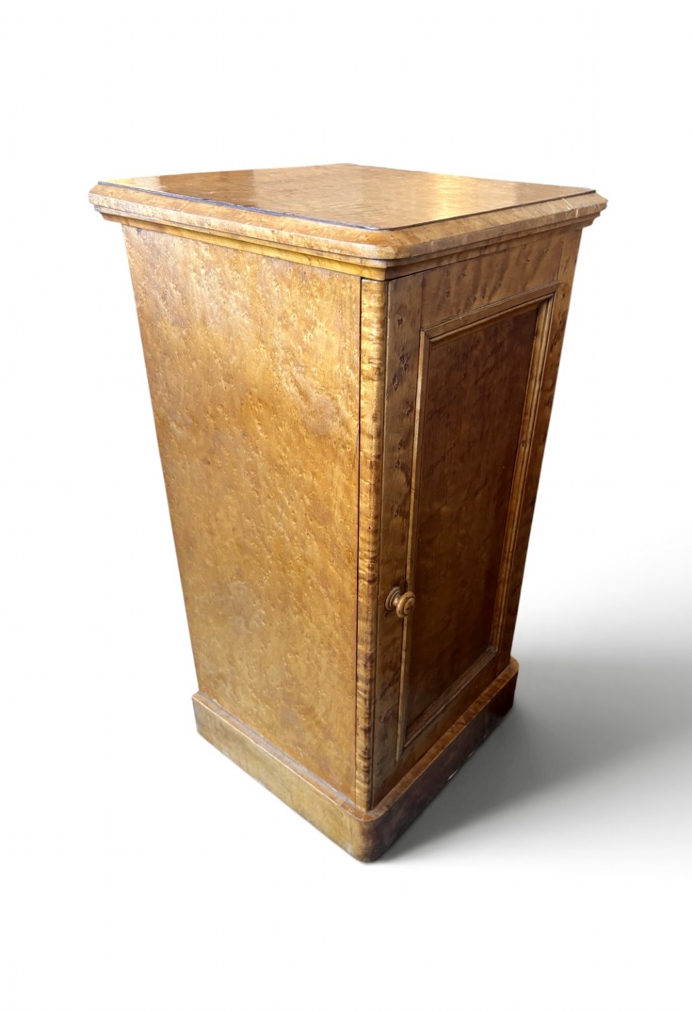 A 19th-century birds eye maple pedestal cupboard featuring a panelled door, turned wooden knob, and plinth base. View III