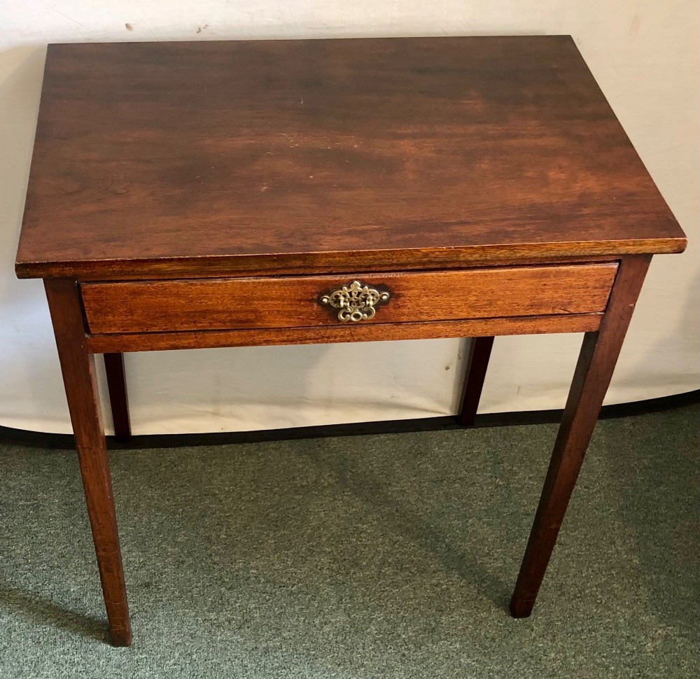 A small George III mahogany side table featuring a single frieze drawer, brass backplate handle, and four straight legs. View II
